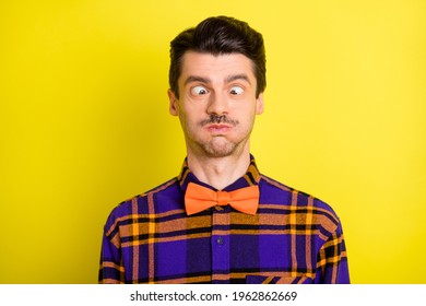 Photo Of Young Man Fooling Grimacing Hold Breath Humor Joke Dumb Silly Isolated Over Yellow Color Background