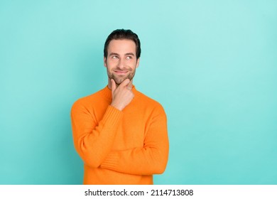 Photo Of Young Man Good Mood Hand Touch Chin Curious Look Empty Space Isolated Over Teal Color Background