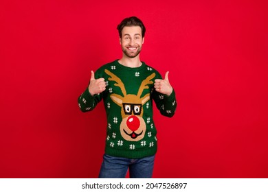 Photo Of Young Man Happy Positive Smile Show Thumbs-up Like Fine Great Christmas Isolated Over Red Color Background