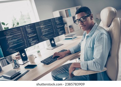 Photo of young man self employed introvert programmer working on freelance github website for coders in internet at office background