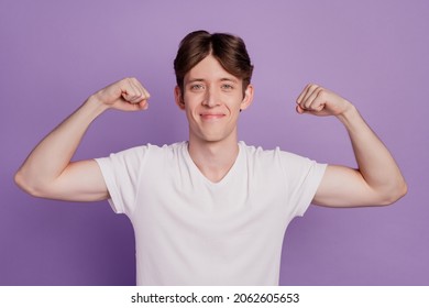 Photo of young man show hands muscles strong bodybuilding sportive isolated over violet color background - Shutterstock ID 2062605653