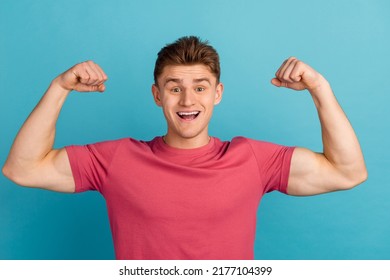 Photo of young man show hands muscles biceps bodybuilding exercise isolated over blue color background - Shutterstock ID 2177104399