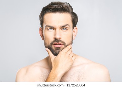 Photo Of Young Man Standing Isolated Over Grey Wall Background Naked. Skincare Concept. 