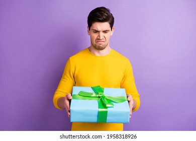 Photo Of Young Man Unhappy Sad Upset Dislike Present Gift Box Birthday Party Isolated Over Violet Color Background