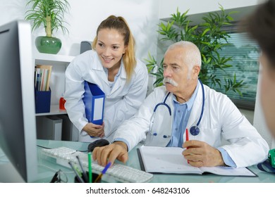 A Photo Of Young Medical Team Checking Patients Xray