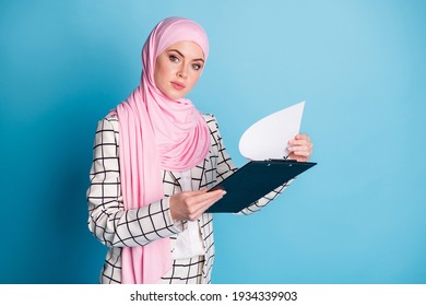 Photo Of Young Muslim Business Woman Serious Hold Clipboard Organizer Checklist Wear Hijab Isolated Over Blue Color Background