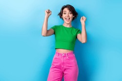 Photo Of Young Overjoyed Funny Girl Raise Fists Up Scream Yell Successful Victory Competition First Place Isolated On Aquamarine Color Background