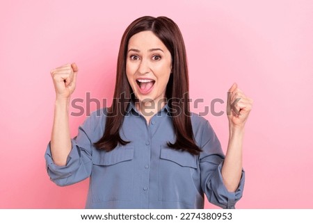 Photo of young overjoyed office assistant girl raise fists up finally growing career salary more income hooray isolated on pink color background
