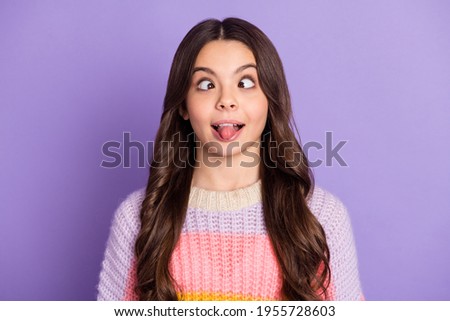 Photo of young preteen girl crazy grimace joke humor tongue-out isolated over purple color background
