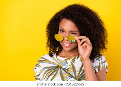 Photo of young pretty afro girl coquettish wink eye hand touch glasses isolated over yellow color background - Shutterstock ID 2065615529