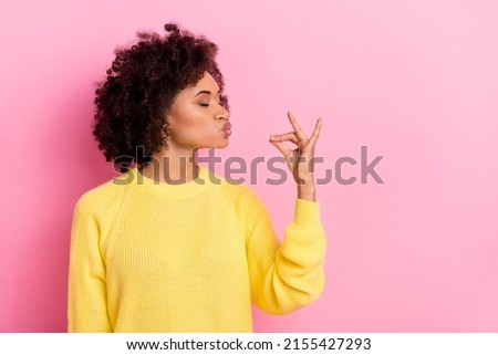 Photo of young pretty girl dream pouted lips hungry show fingers yummy symbol isolated over pink color background