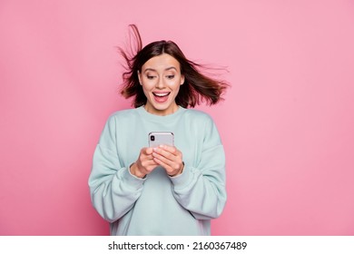 Photo of young pretty girl good news comment popular app download isolated over pink color background
