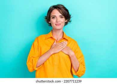 Photo Of Young Pretty Nice Cute Adorable Woman Wear Office Shirt Folded Palms Touch Chest Admire Isolated On Aqumarine Color Background