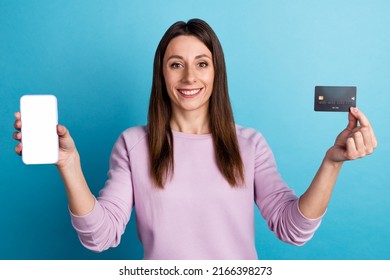 Photo Of Young Pretty Woman Show Mobile Credit Card Benefit App Download Cashback Isolated Over Blue Color Background