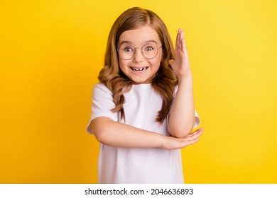 Photo Of Young School Girl Happy Positive Smile Rise Hand Answer Student Smart Lesson Isolated Over Yellow Color Background