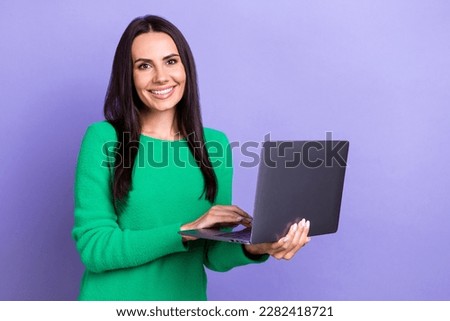 Photo of young successful it company developer lady hold her new hp laptop online corporate meeting remote isolated on purple color background
