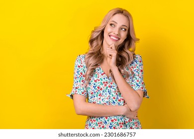 Photo of young thoughtful adorable wavy hair girl touch chin interested mockup choosing best ice cream isolated on yellow color background