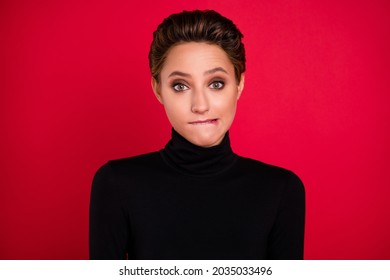 Photo Of Young Unhappy Doubtful Uncertain Woman Bite Lips Teeth Nervous Isolated On Red Color Background