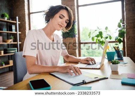 Photo of young woman brown bob hair first job dealer prepare contract for sale products browsing laptop isolated new office background