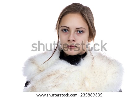 Photo of the young woman in fur on white background