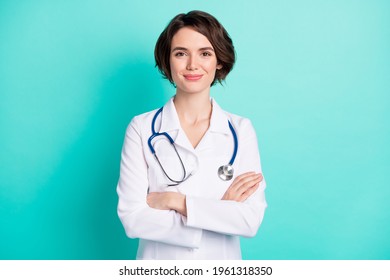Photo of young woman happy positive smile folded hands intern medic isolated over teal color background