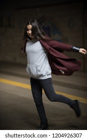 Photo Of Young Woman In Night Subway Walking Forward