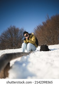 Photo Of A Young Woman On A Snowy Moutain Hike. 