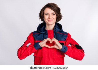 Photo of young woman paramedic happy smile showing fingers heart symbol cardiac isolated over white color background