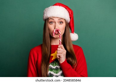 Photo Of Young Woman Plump Lips Fooling Candy Sweet Christmas Spirit Isolated Over Green Color Background