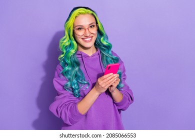 Photo of youth lady with vivid hairdo use app smartphone social network like wear sweater isolated over violet color background