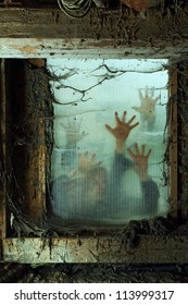 Photo Of Zombies Outside A Window That Is Covered With Spiderwebs And Filth.