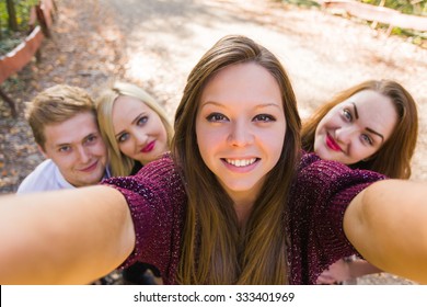 Photobomb Performed By Her Good Friends While She Took A Selfie For Social Network - The Camera's Point Of View.