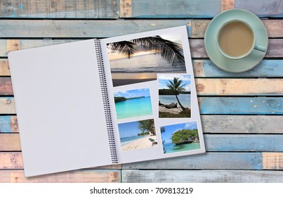 Photobook Album With Travel Photo On Wooden Floor Table With Coffee Or Tea In Cup