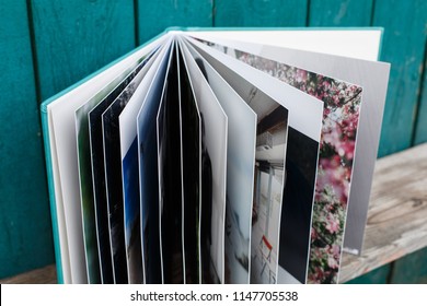 photobook with leather cover.
open photo book on the bright background.opened wedding album.
Photoalbum on a wooden surface.
photobook pages
Expanded family photo album.open album turn