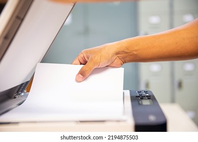 Photocopier Printer, Close Up Hand Office Man Scanning Paper On The Copier Or Photocopy Machine Concept Of Scanner Document Or Printing Or Xerox A Sheet.