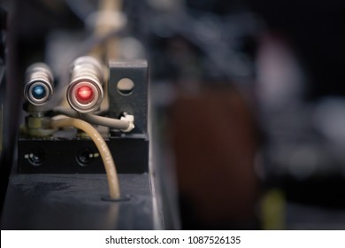 Photoelectric Sensor for distance detection in machine factory. Photo sensor installed in industrial machine. Industrial and Technology concept. - Shutterstock ID 1087526135