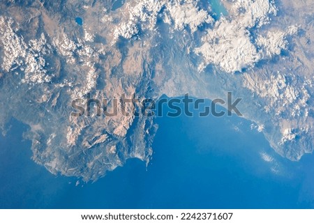 Photograph of Antalya Turkey taken from space. Satellite view of mountain range and coastline taken from above. Bird's eye view of the Mediterranean coast. Elements of this image furnished by NASA.