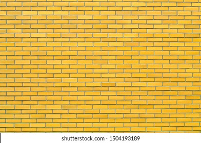 Photograph of a brick yellow wall