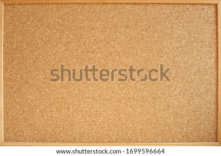 Photograph of a cork panel in a wooden frame ideal for backgrounds and textures. Panel for notes and photos of all kinds.