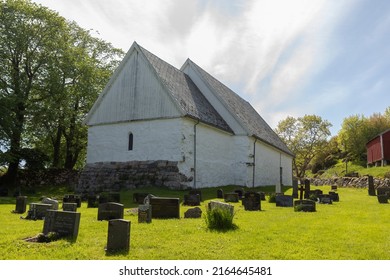 A Photograph Of Dolm Church, A Building From The Norwegian Middle Ages. This Holy Place Is Visited Every Year By Pilgrims. 06.06.2022, Dolmøy, Hitra, Norway