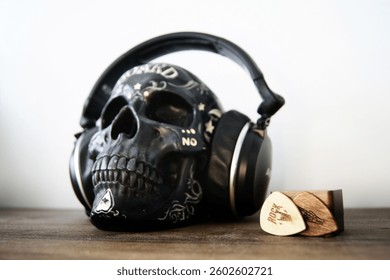 A photograph featuring a skull wearing a pair of headphones
