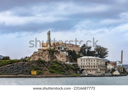Photograph of the federal prison of Alcatraz on its island in the middle of the San Francisco Bay in California, USA. Prison of the United States of America of maximum security. Prison concept.