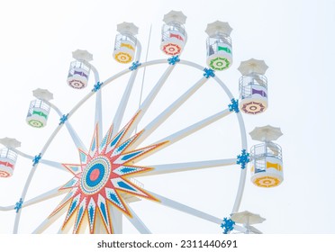 Photograph of the Ferris wheel ride, located in Sunset Park La Libertad, El Salvador. - Shutterstock ID 2311440691
