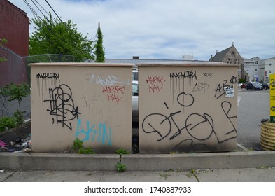 A Photograph Of A Graffiti On A Clothing Donation Bin.