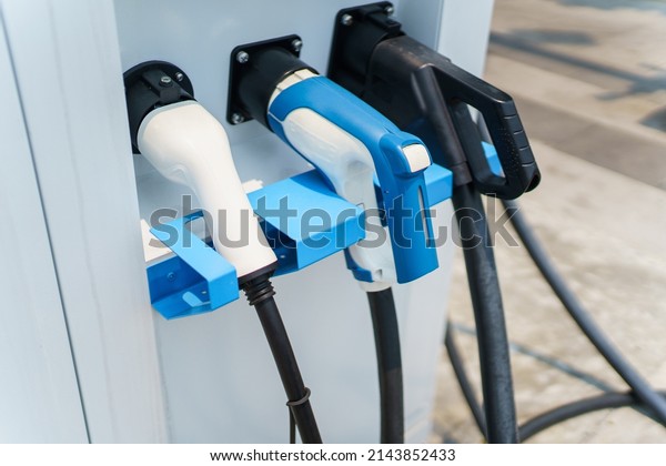 Photograph of the modern electric\
vehicle charging station or EV quick charging station for battery\
electric vehicle and plug-in hybrid electric\
vehicle.