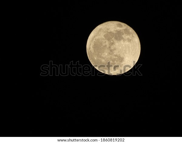Photograph of the moon\
on a cold autumn\
night