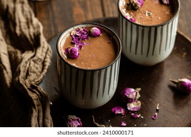 A photograph of mugs of homemade, healthy hot chocolate or cacao in a cacao ceremony