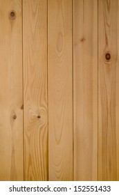 Photograph Of A Panel Of Light Wood Tongue And Groove Planking, Shot Vertically.