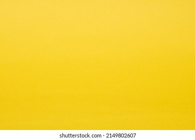 Photograph Of Plain Yellow Construction Paper Texture Background. 