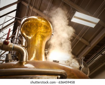 A Photograph Of A Pot Still In A Whiskey Distillery. Steam Is Rising From The Still To The Top Of Warehouse As The Still Is Going Through A Distillation Process.